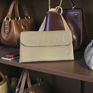 Vintage mesh clutch in a warm cream color with black interior and zip pocket